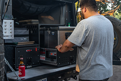 a man pulling out his 4x4 drawer and slider